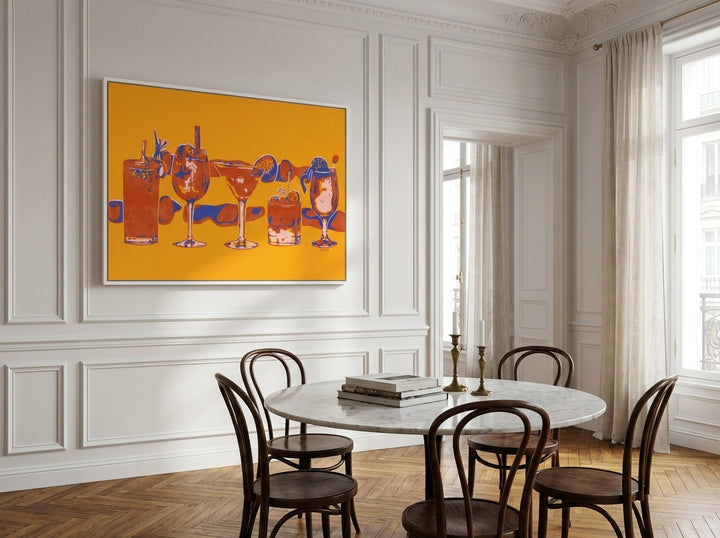Oversized statement canvas wall art with a white surround styled on the wall in a Parisian dining room