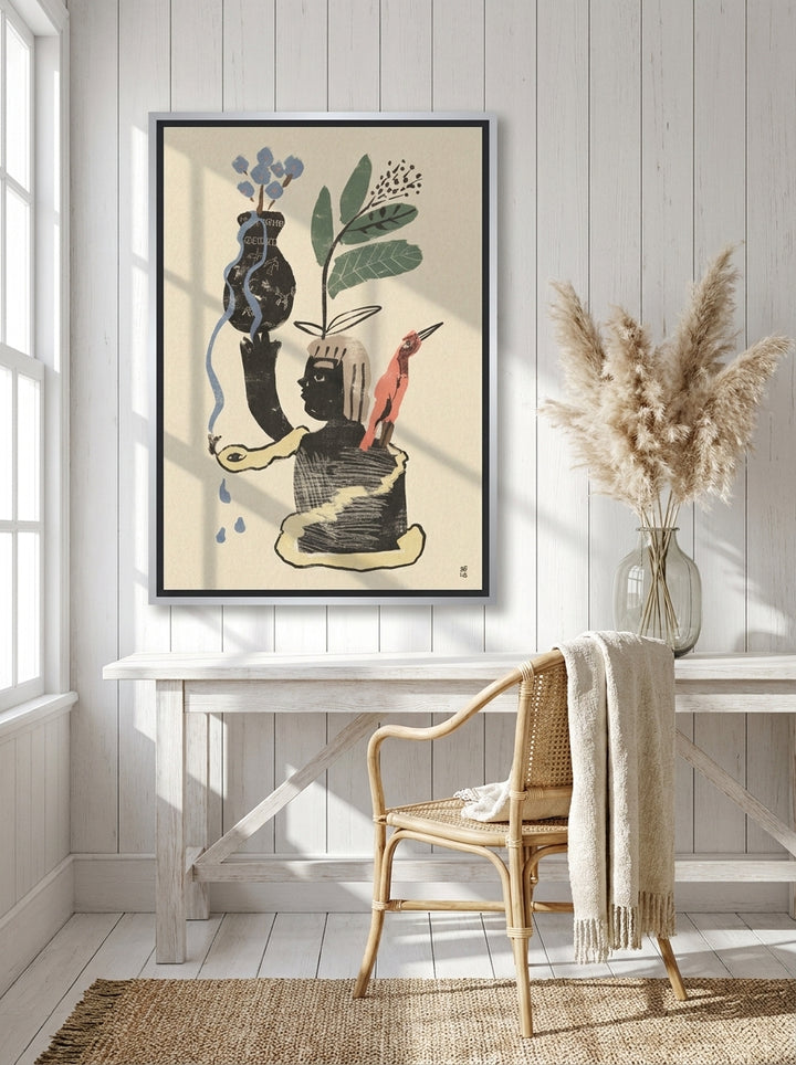 Canvas wall art with a silver leaf surround styled on the wall in a coastal home office