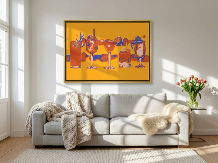 Canvas wall art with a gold leaf surround styled on the wall in a bright Scandinavian living room