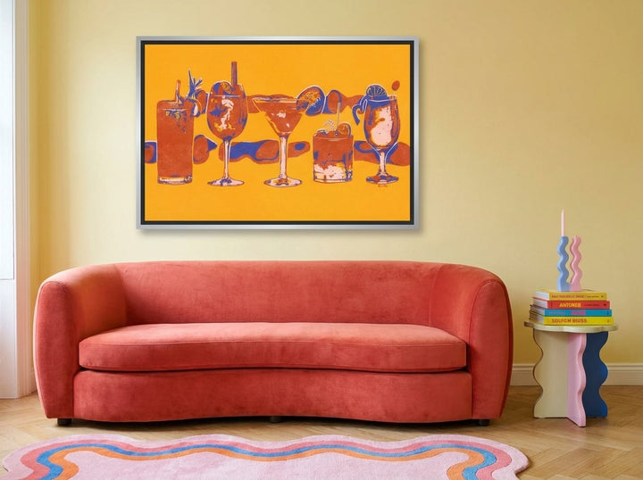 Canvas wall art with a silver leaf surround styled on the wall in a colourful eclectic living room
