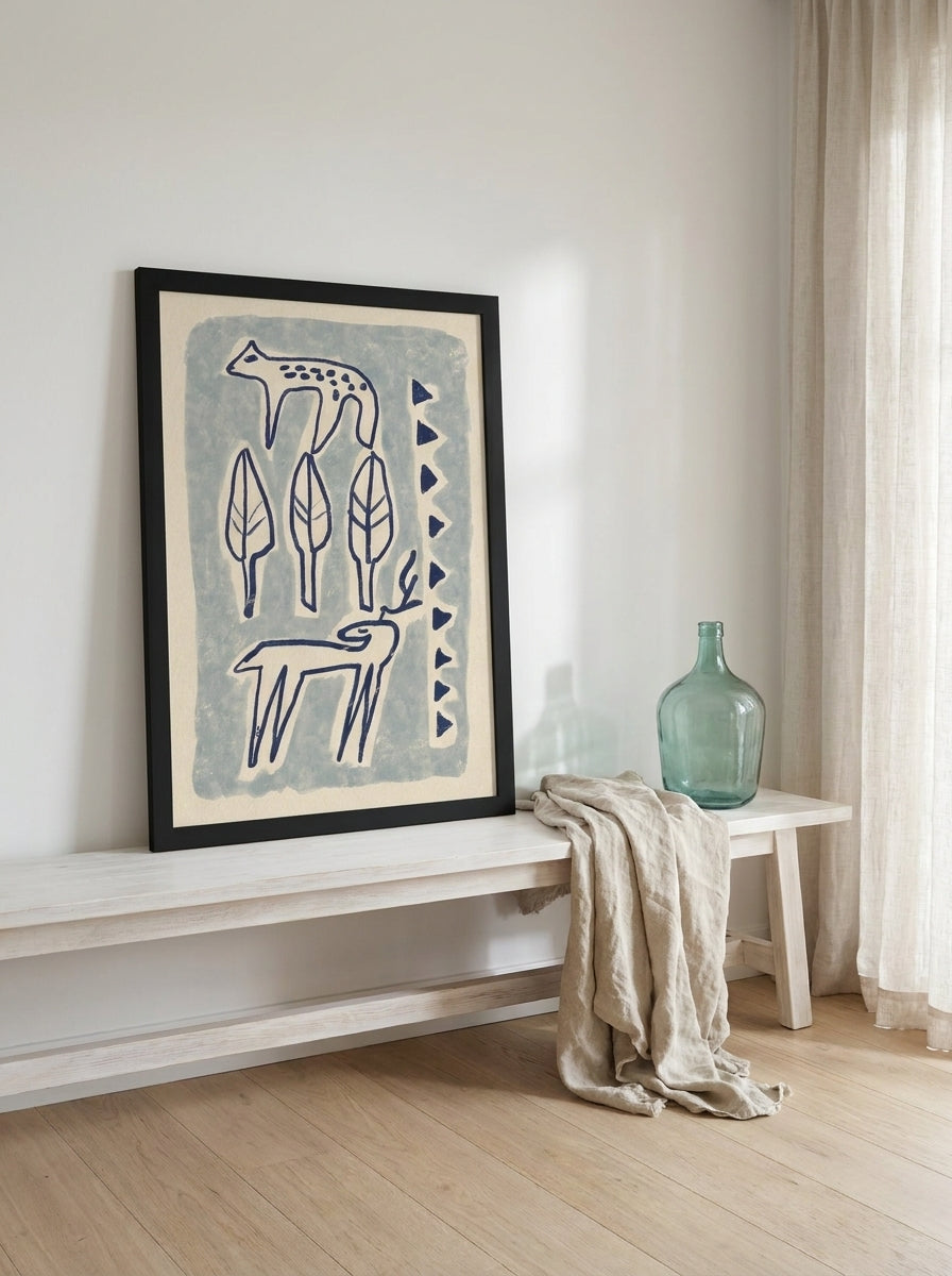 Modern wall art print standing on a console in a coastal bedroom