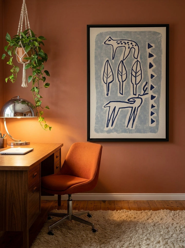 Canvas wall art with a black surround styled on the wall in a retro 70s home office