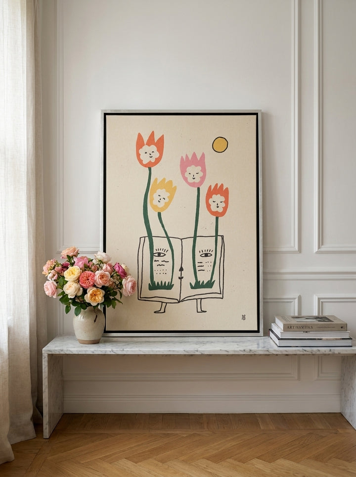 Canvas wall art with a silver leaf surround standing on a console in a Parisian bedroom