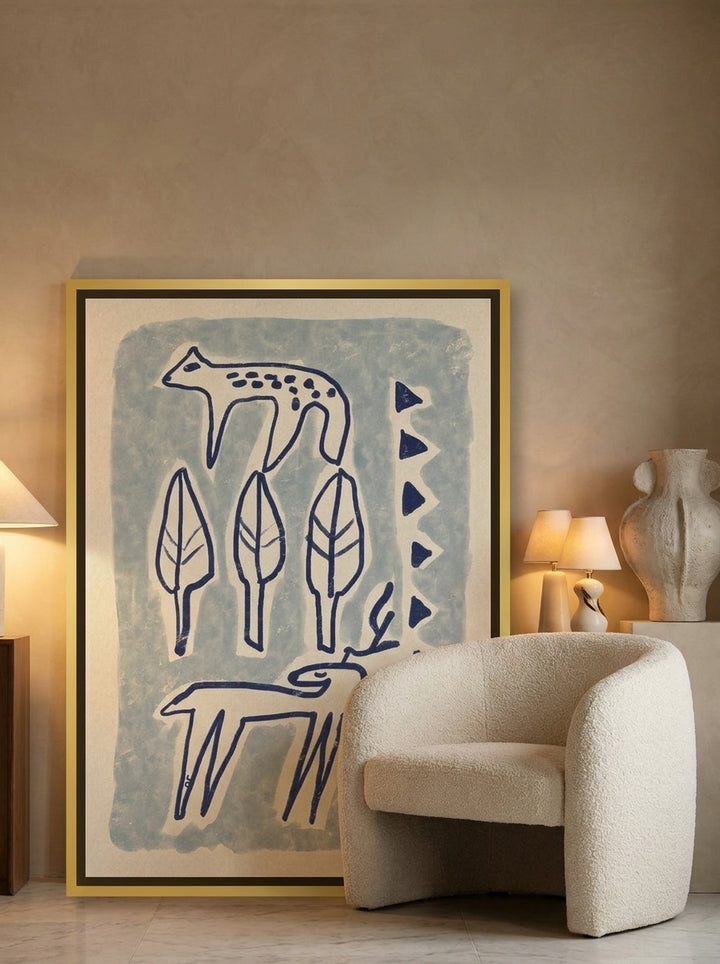 Canvas wall art with a gold leaf surround leaning against the wall in a luxe bedroom