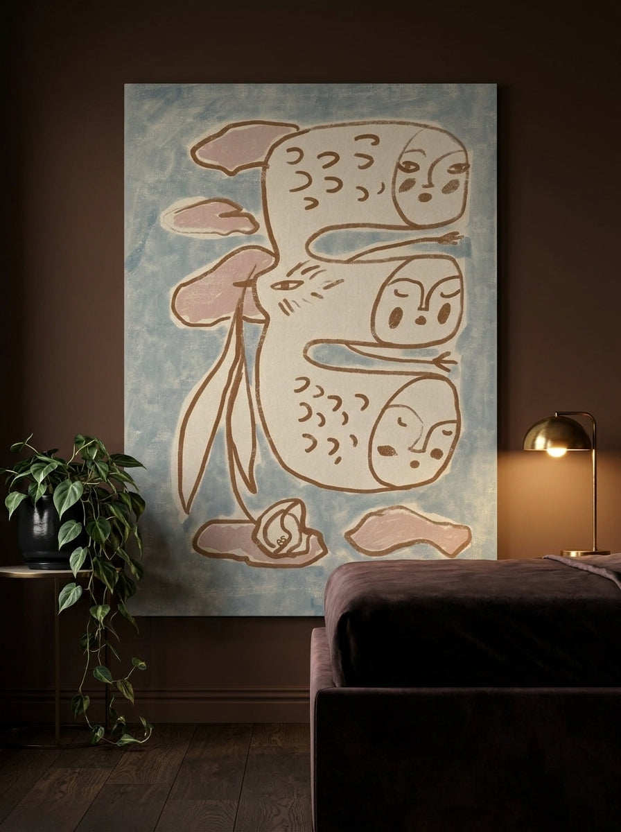 Stretched canvas wall art styled on the wall in a moody bedroom