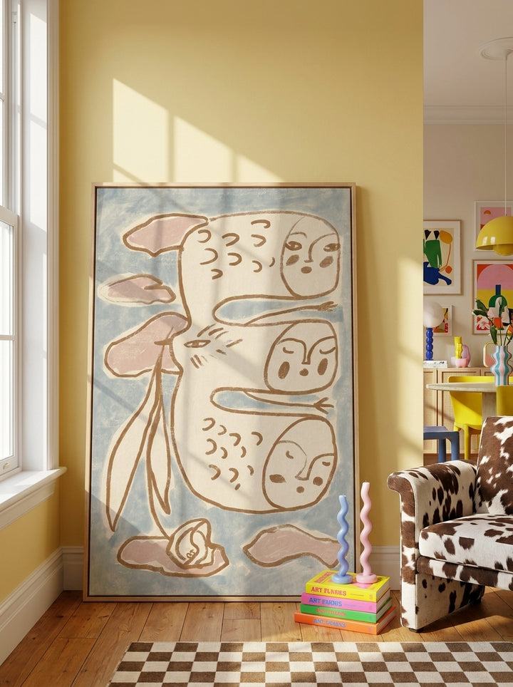 Oversized statement canvas wall art with a natural timber surround leaning against the wall in a colourful eclectic dining room