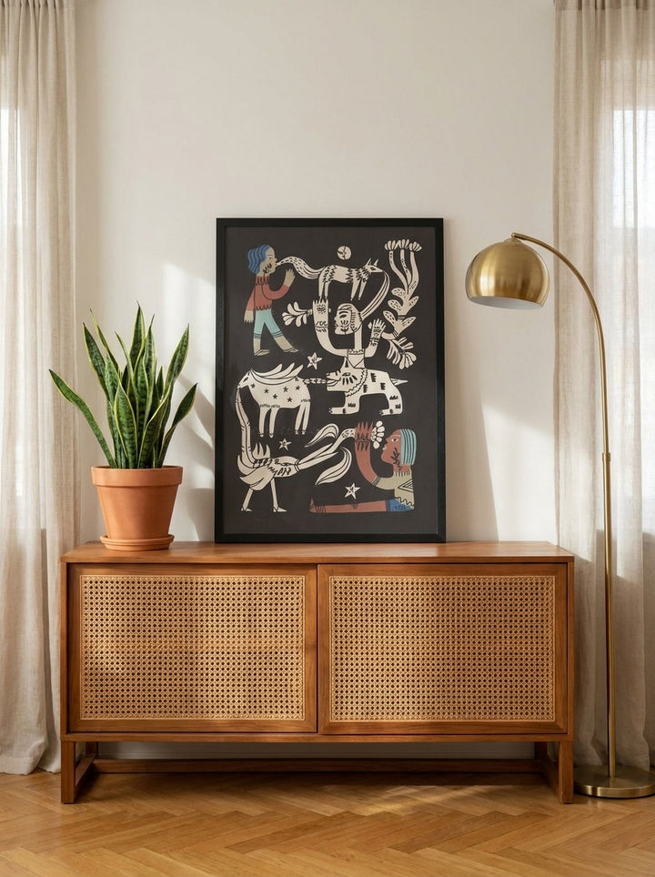 Modern wall art print standing on a sideboard in a mid-century living room