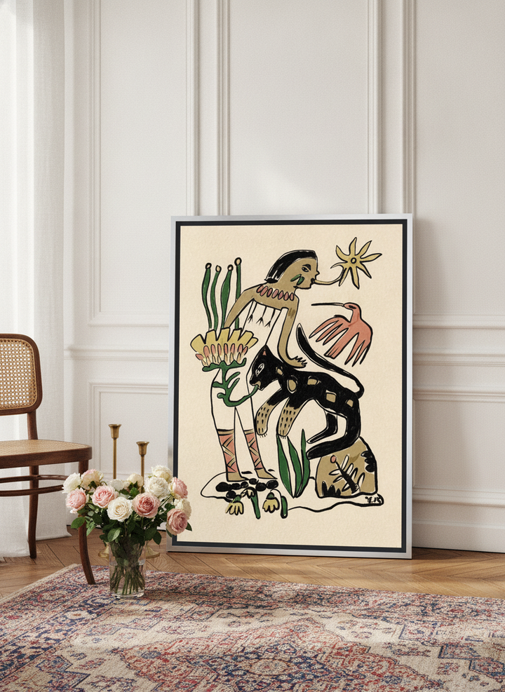 Canvas wall art with a silver leaf surround leaning against the wall in a Parisian bedroom