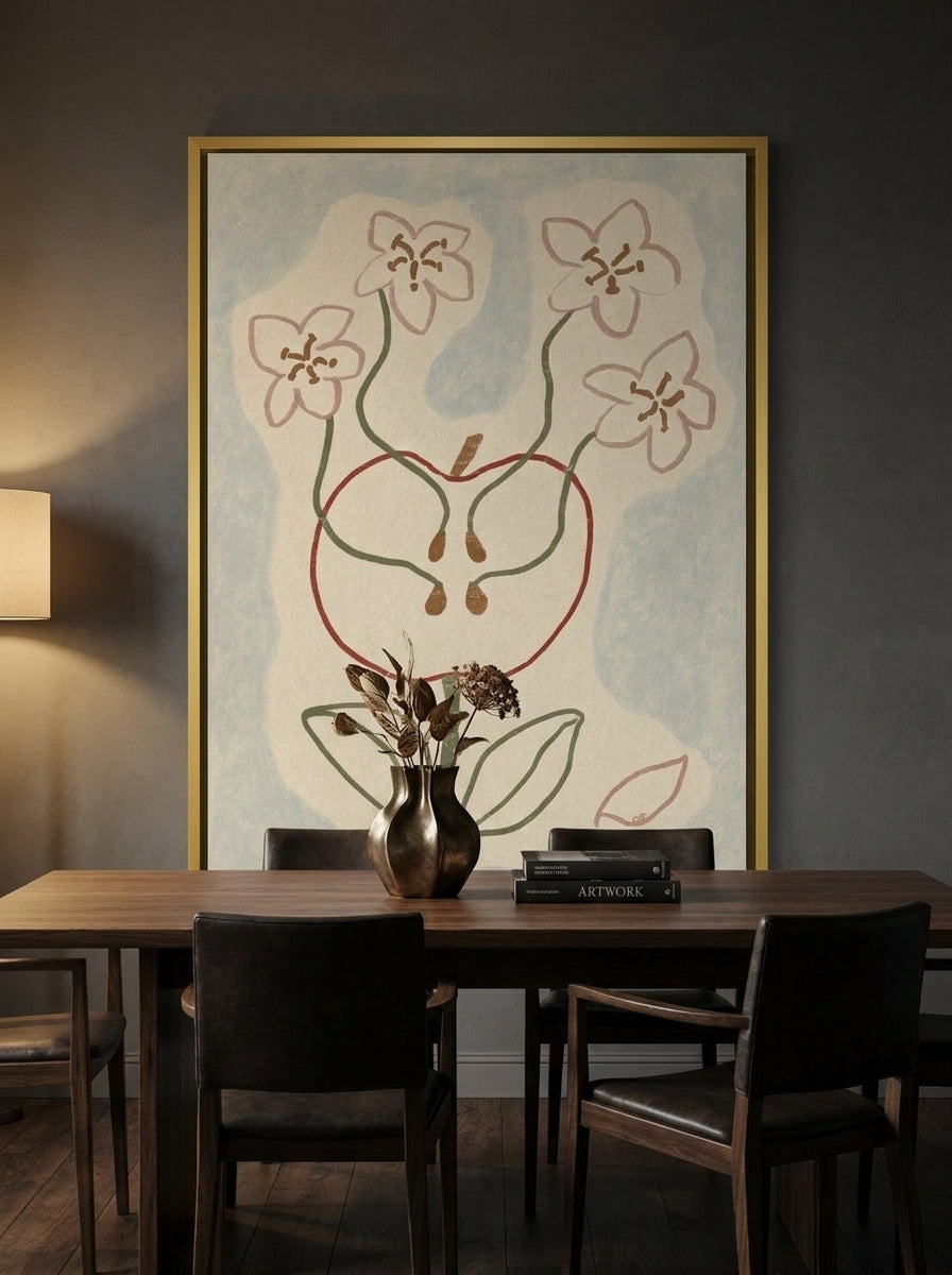 Canvas wall art with a gold leaf surround styled on the wall in a moody dining room