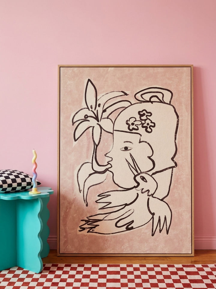 Oversized statement modern wall art print leaning against the wall in a colourful eclectic dining room