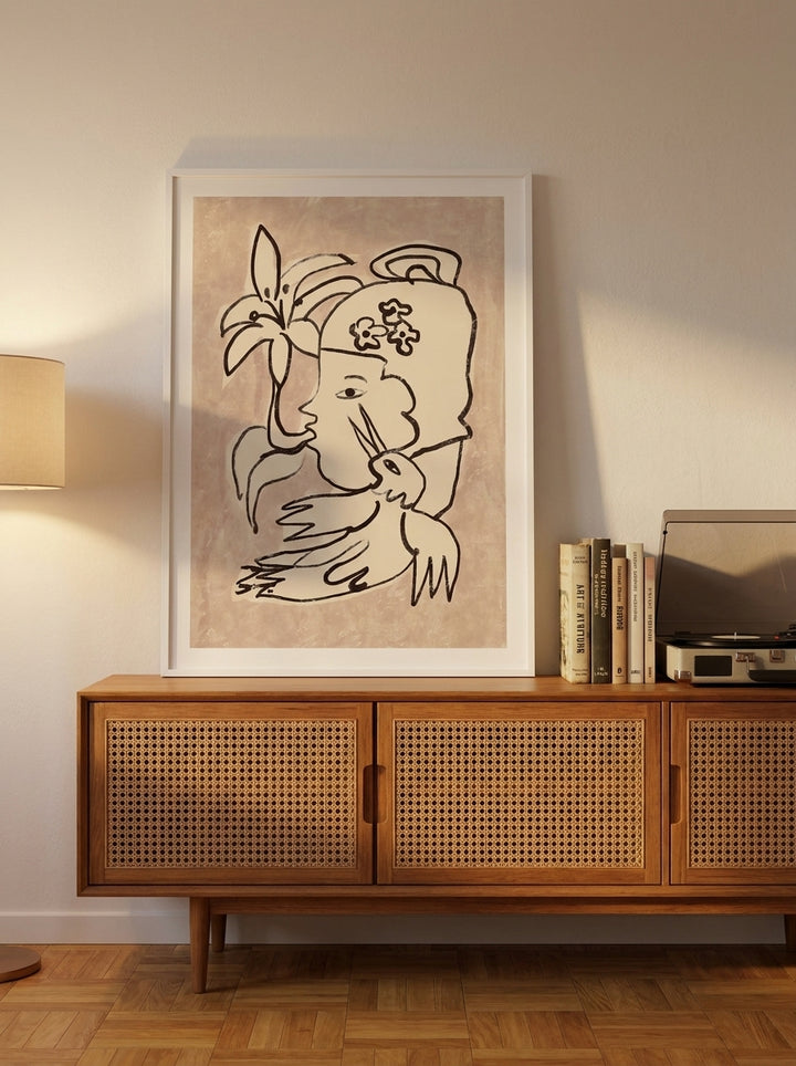 Modern wall art print standing on a sideboard in a mid-century bedroom
