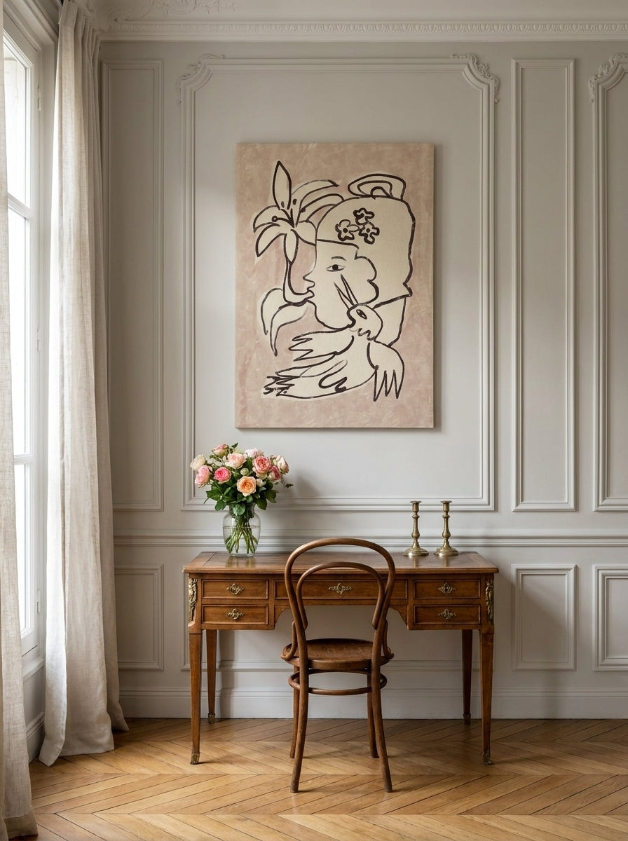 Stretched canvas wall art styled on the wall in a Parisian home office