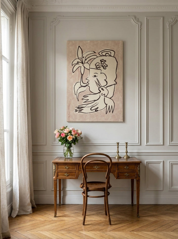 Stretched canvas wall art styled on the wall in a Parisian home office