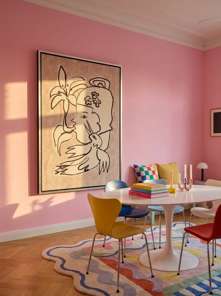 Oversized statement canvas wall art with a silver leaf surround styled on the wall in a colourful eclectic dining room