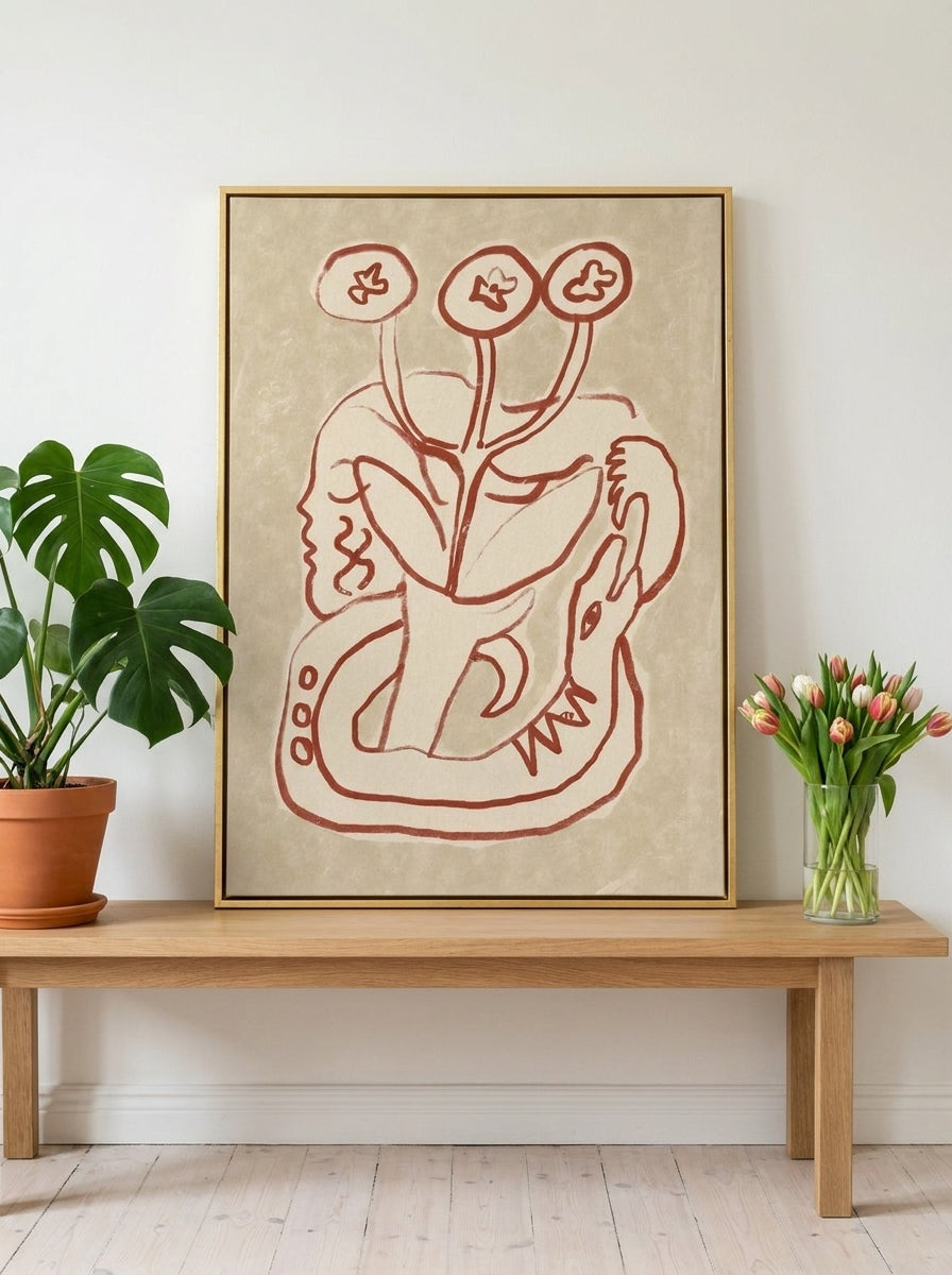 Canvas wall art with a gold leaf surround standing on a bench in a bright Scandinavian bedroom