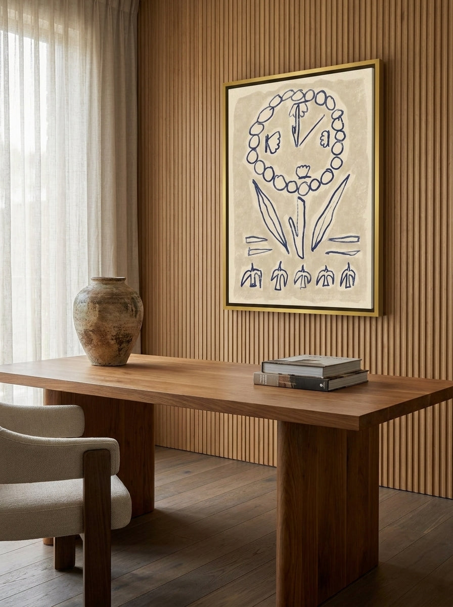 Canvas wall art with a gold leaf surround styled on the wall in a luxe home office