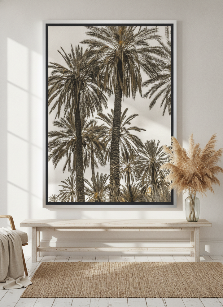 Oversized statement canvas wall art with a silver leaf surround styled on the wall in a coastal living room