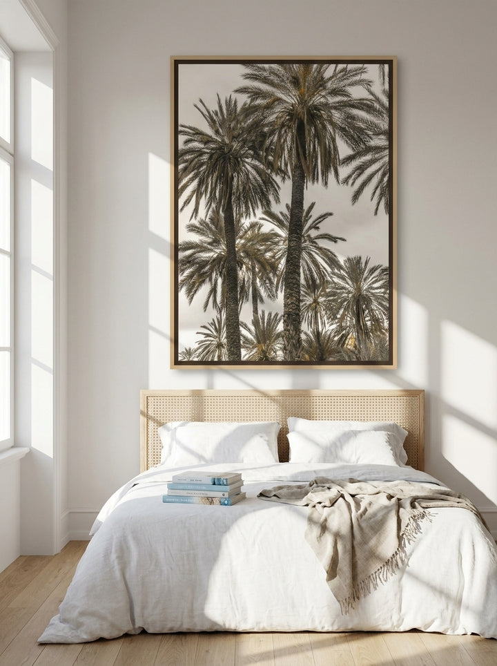 Oversized statement canvas wall art with a natural timber surround styled on the wall in a coastal bedroom