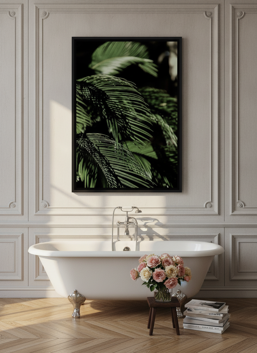 Canvas wall art with a black surround styled on the wall in a Parisian bathroom