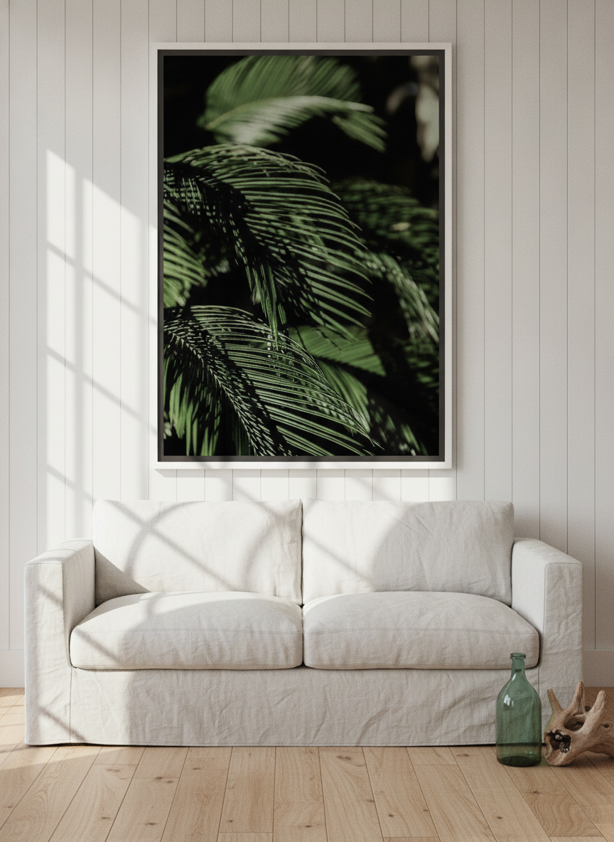 Oversized statement canvas wall art with a white surround styled on the wall in a coastal living room