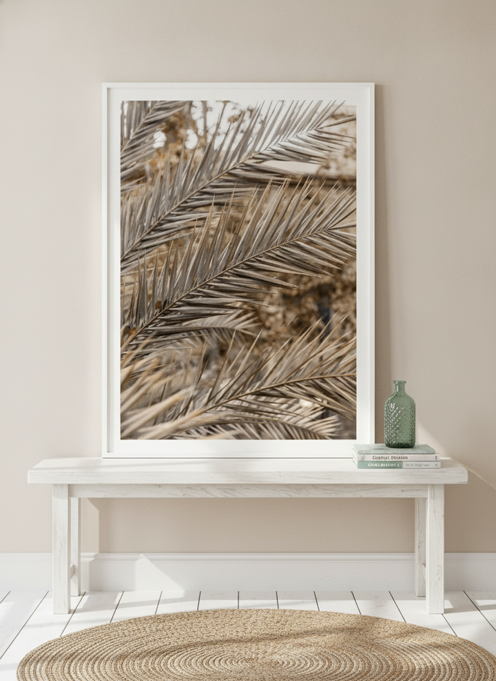 Modern wall art print standing on a console in a coastal bathroom