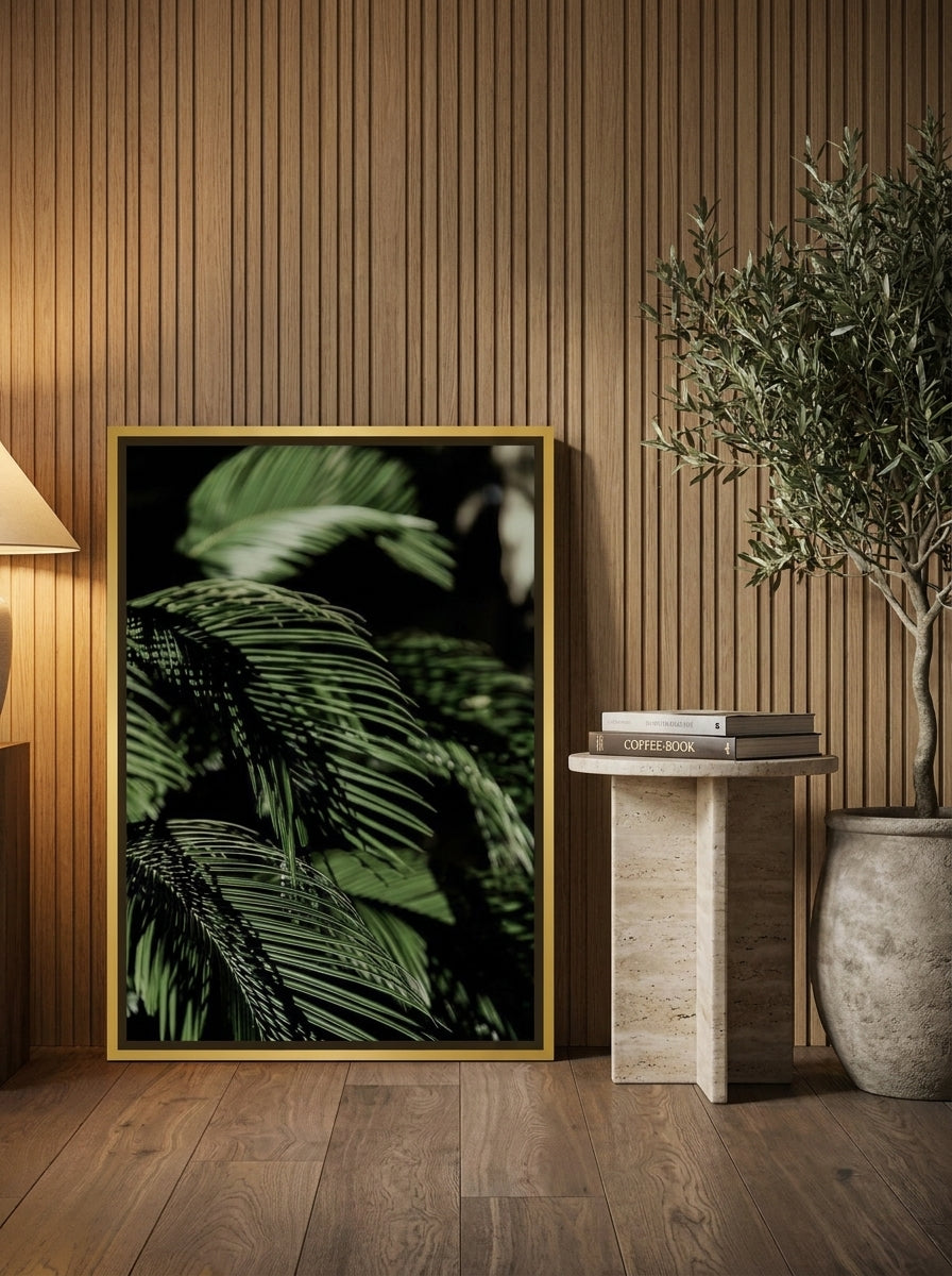 Canvas wall art with a gold leaf surround leaning against the wall in a luxe living room