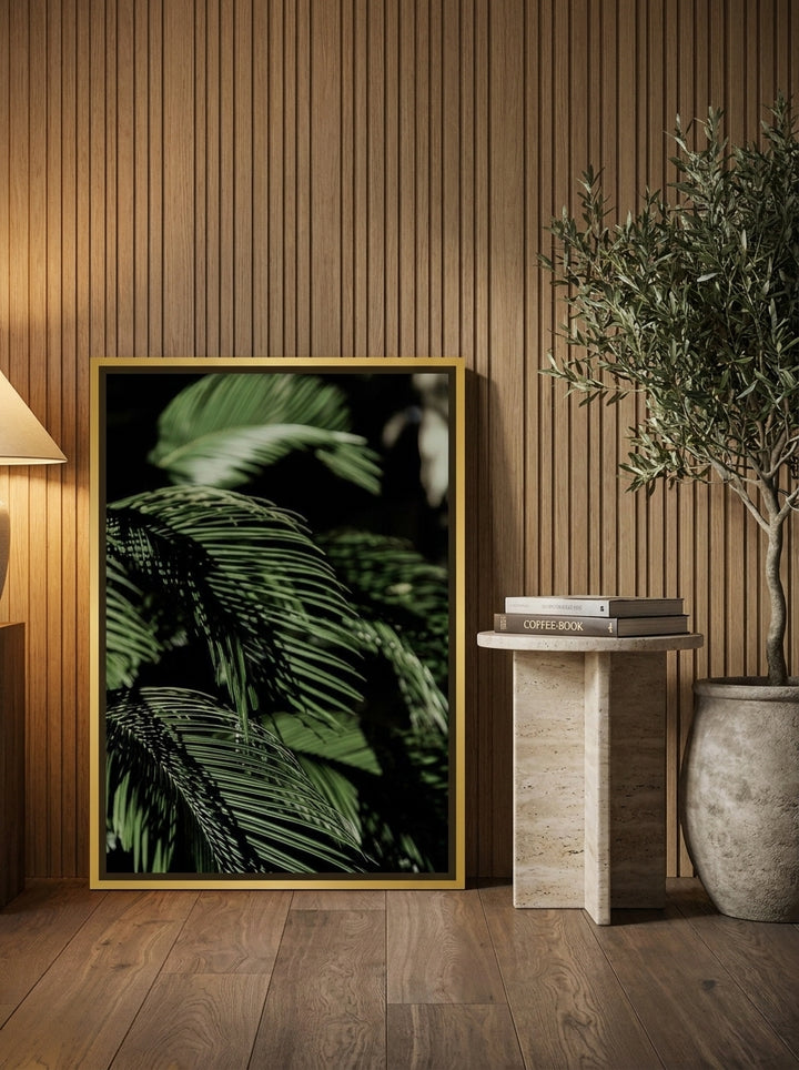 Canvas wall art with a gold leaf surround leaning against the wall in a luxe living room