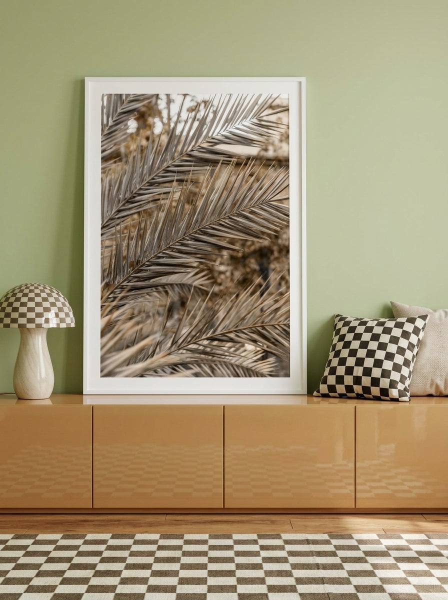 Modern wall art print standing on a sideboard in a colourful eclectic bedroom