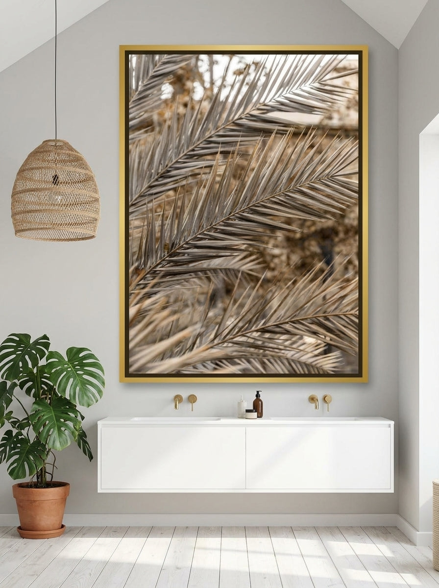 Oversized statement canvas wall art with a gold leaf surround styled on the wall in a bright Scandinavian bathroom