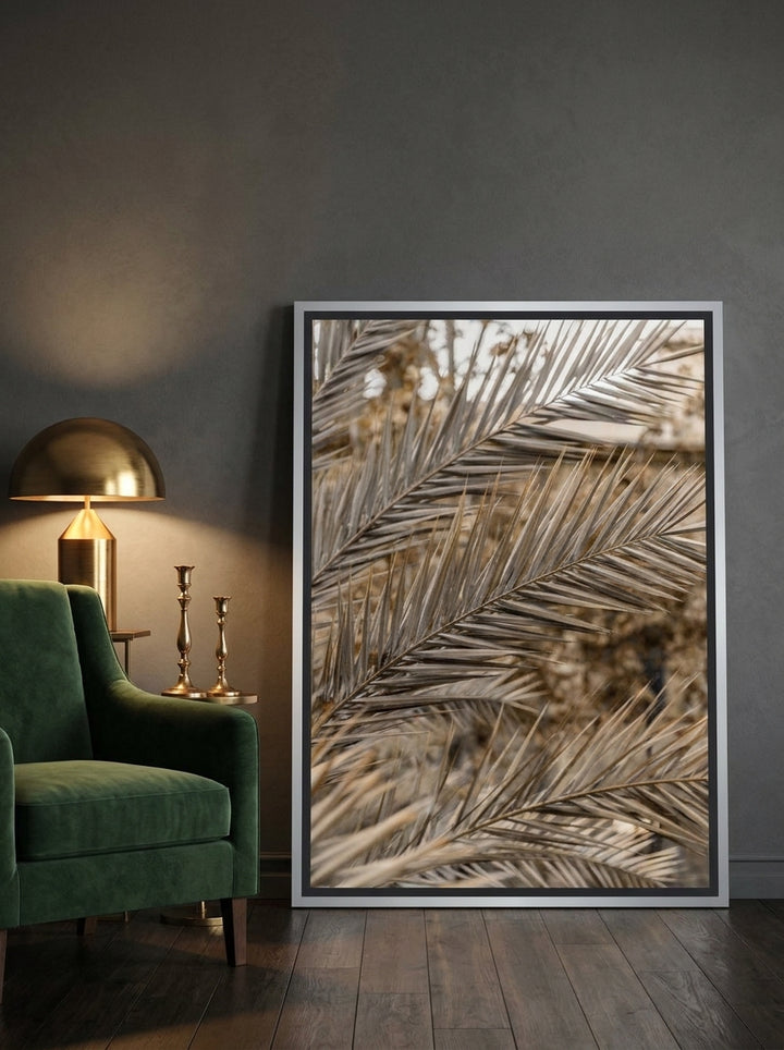 Canvas wall art with a silver leaf surround leaning against the wall in a moody home office