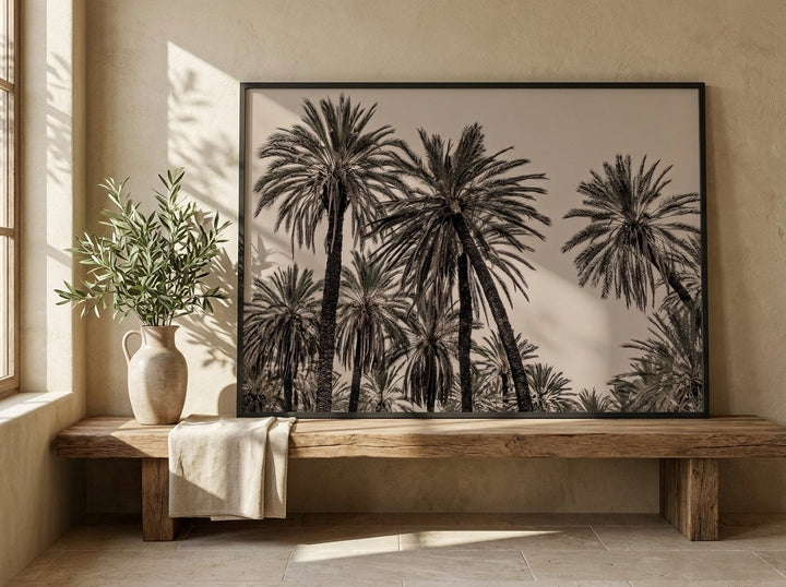 Modern wall art print standing on a bench in a Mediterranean bedroom