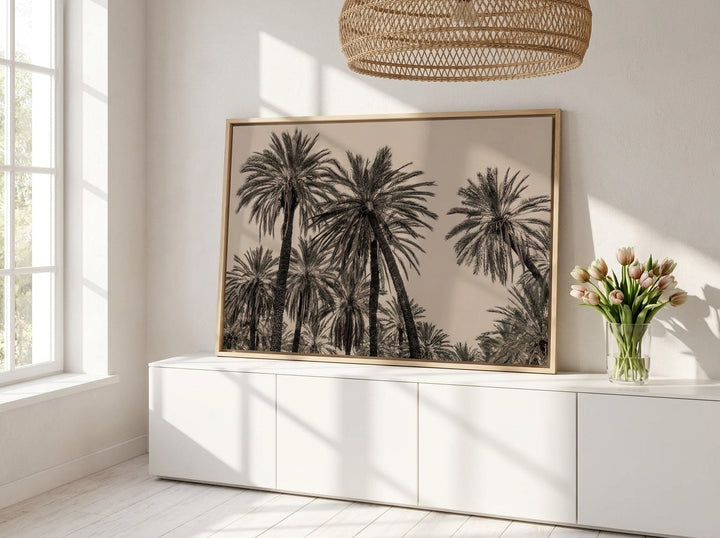 Canvas wall art with a natural timber surround standing on a sideboard in a bright Scandinavian home office