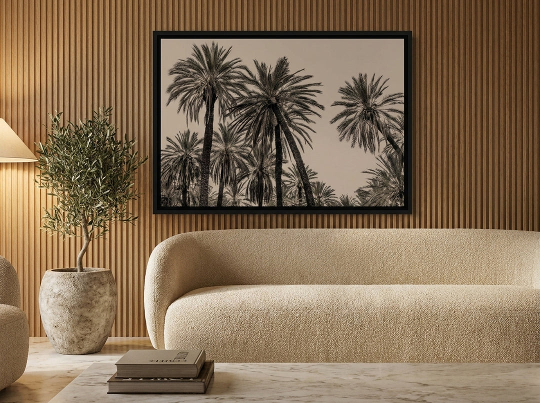 Oversized statement canvas wall art with a black surround styled on the wall in a luxe living room