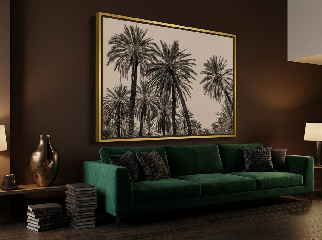 Oversized statement canvas wall art with a gold leaf surround styled on the wall in a moody living room