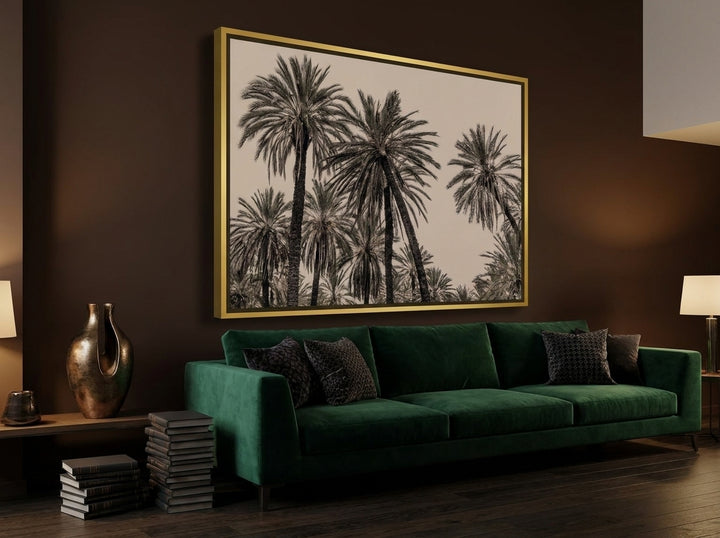 Oversized statement canvas wall art with a gold leaf surround styled on the wall in a moody living room