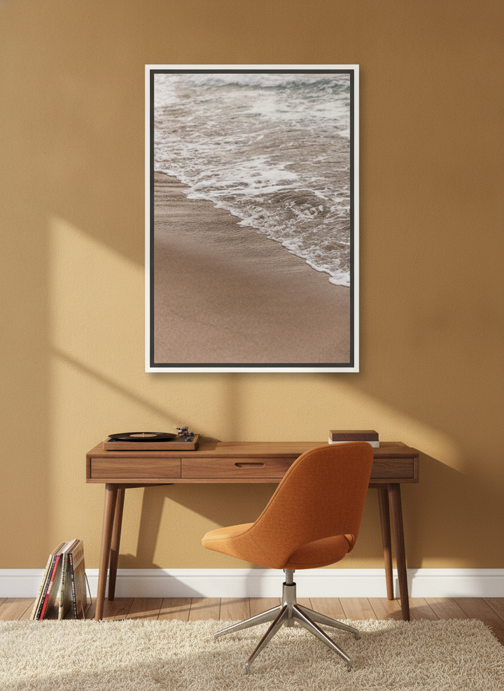 Canvas wall art with a white surround styled on the wall in a retro 70s home office