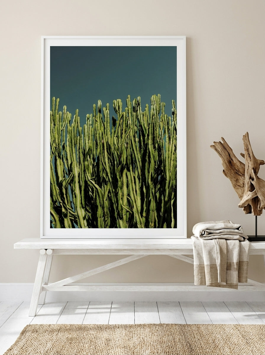 Modern wall art print standing on a console in a coastal bedroom
