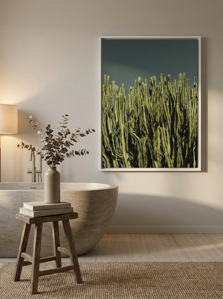 Canvas wall art with a white surround styled on the wall in a warm Japandi bathroom