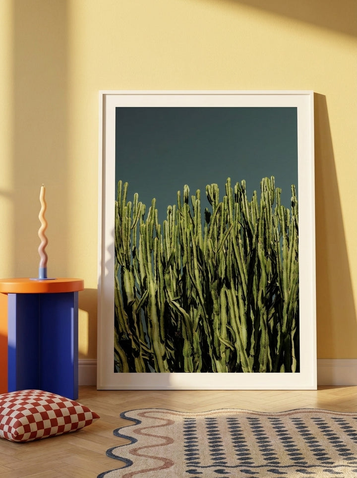 Oversized statement modern wall art print leaning against the wall in a colourful eclectic living room