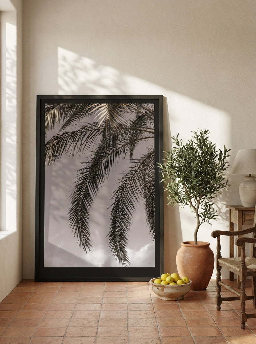 Oversized statement modern wall art print leaning against the wall in a Mediterranean dining room