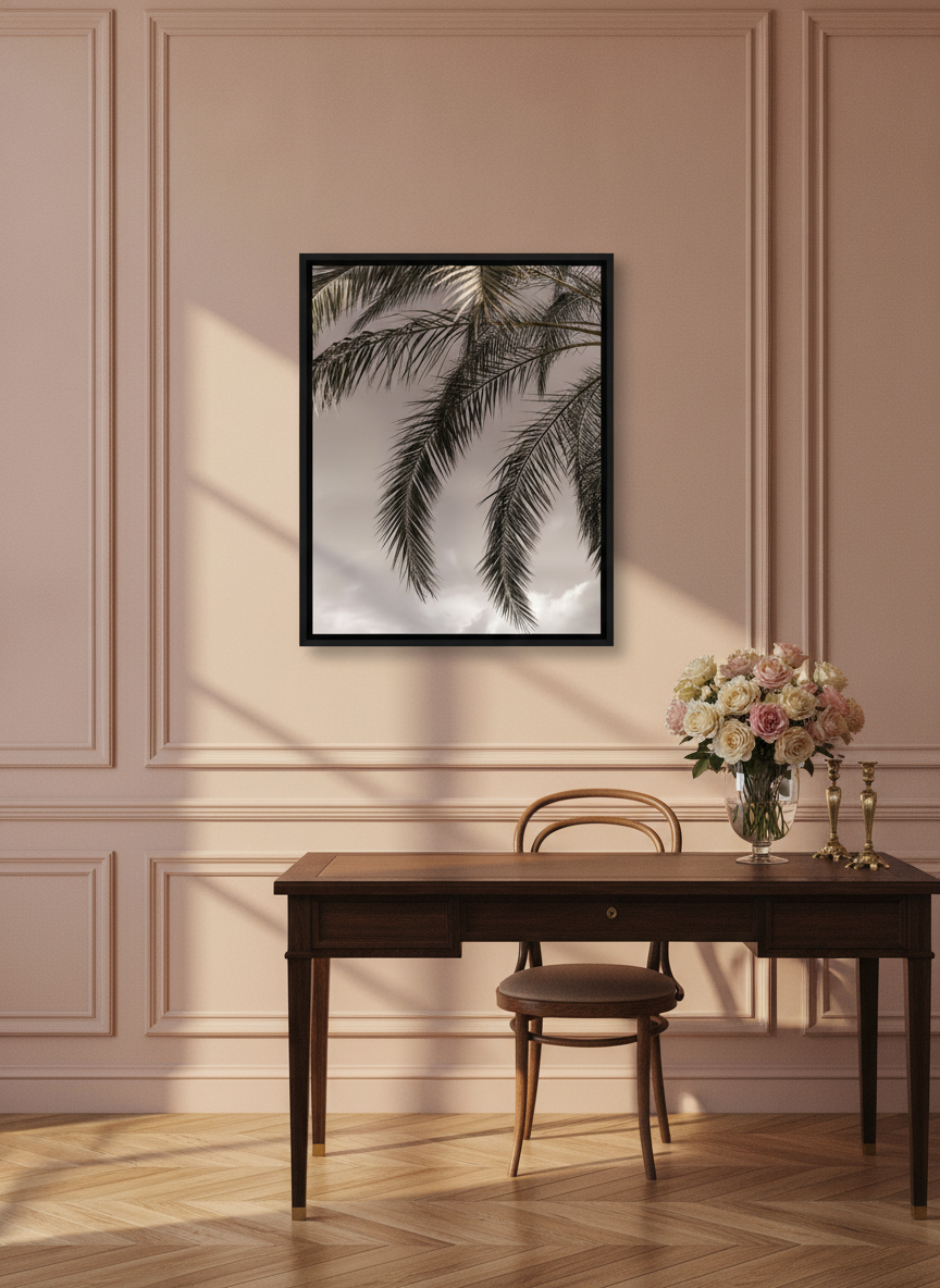 Canvas wall art with a black surround styled on the wall in a Parisian home office