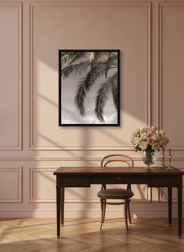 Canvas wall art with a black surround styled on the wall in a Parisian home office