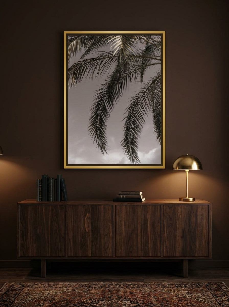 Canvas wall art with a gold leaf surround styled on the wall in a moody living room