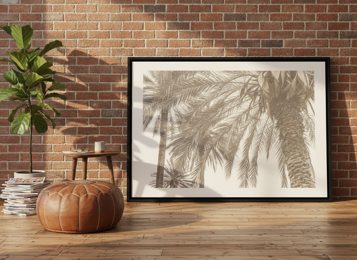 Canvas wall art with a black surround leaning against the wall in an industrial loft dining room