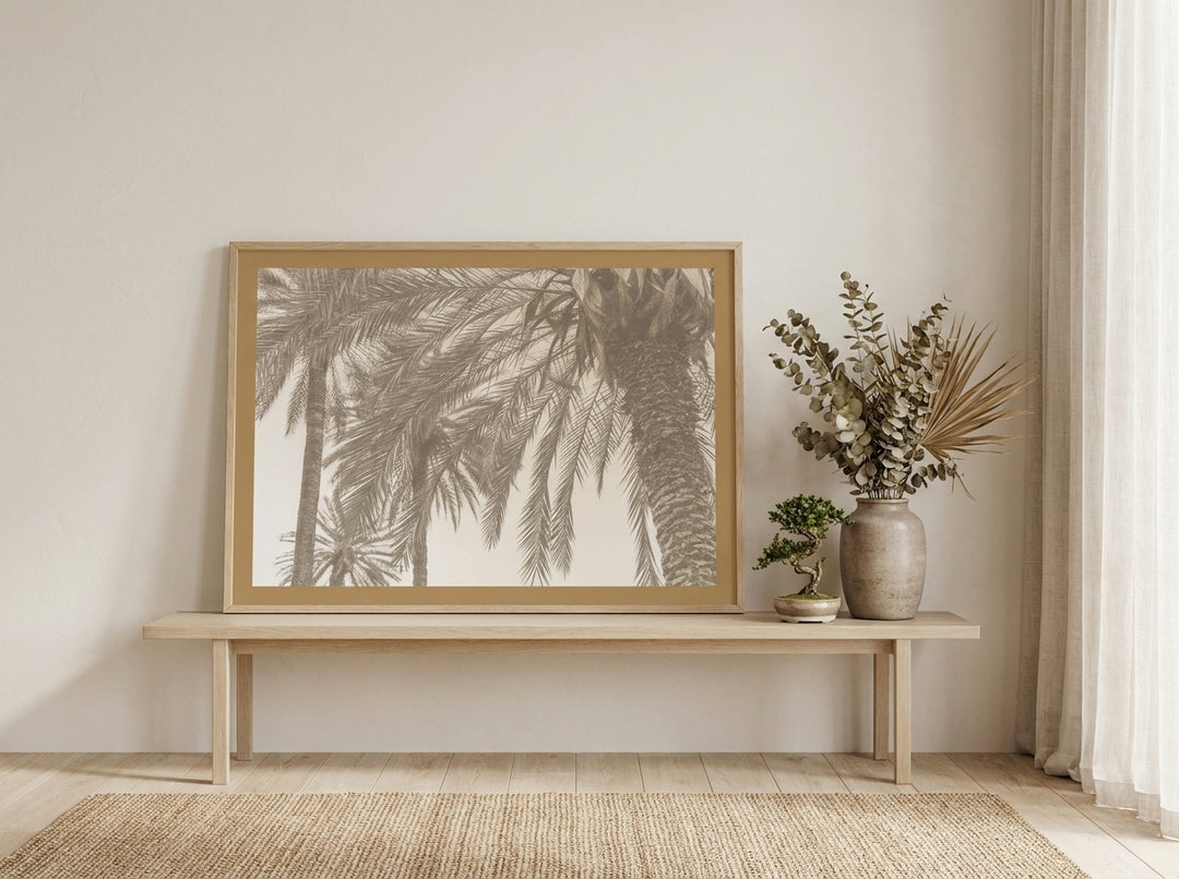 Modern wall art print standing on a bench in a warm Japandi dining room