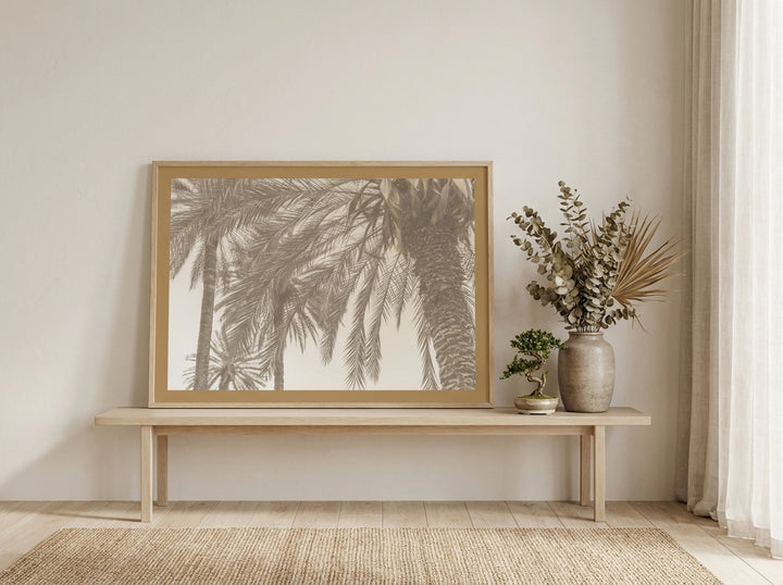 Modern wall art print standing on a bench in a warm Japandi dining room