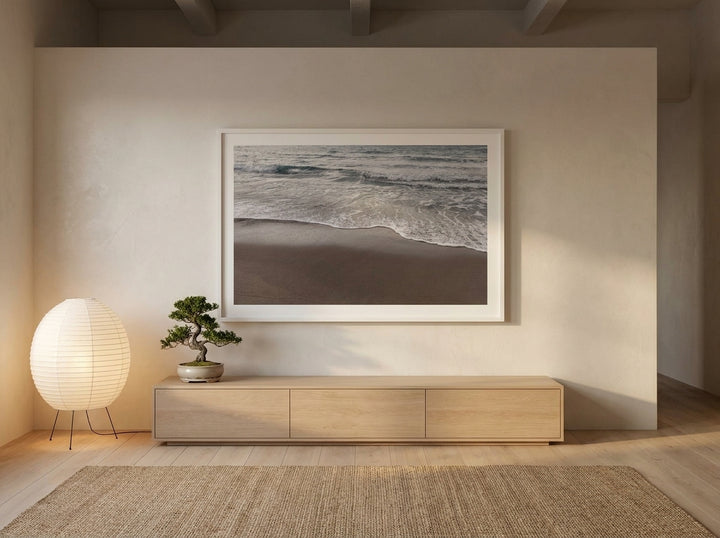 Oversized statement modern wall art print styled on the wall in a warm Japandi living room