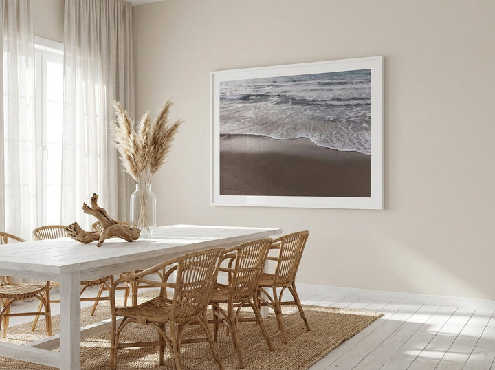 Oversized statement modern wall art print styled on the wall in a coastal dining room