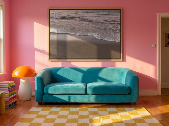 Oversized statement canvas wall art with a natural timber surround styled on the wall in a colourful eclectic living room