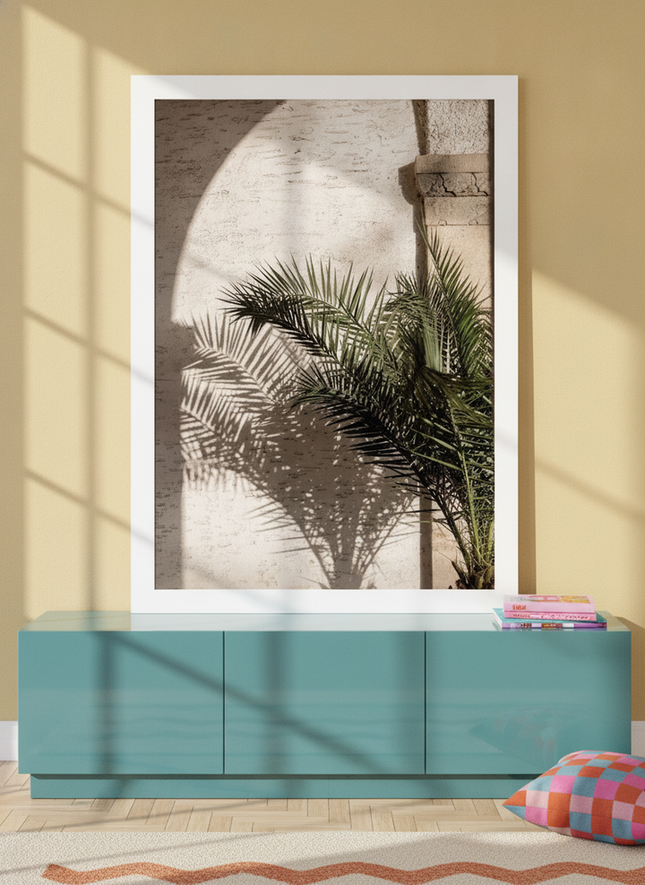 Modern wall art print standing on a sideboard in a colourful eclectic living room
